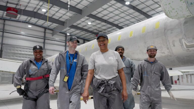 Group of employees from Dean Baldwin Painting, smiling and happy